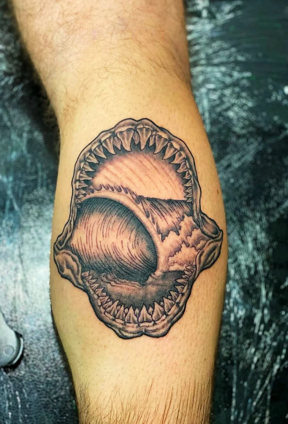 Black & Grey shark jaws with wave inside tattoo on calf by 2bit (Chris Curren) at Lost at Sea Tattoo, Chinatown, Honolulu Black & Grey shark jaws with wave inside tattoo on calf by 2bit (Chris Curren) at Lost at Sea Tattoo, Chinatown, Honolulu