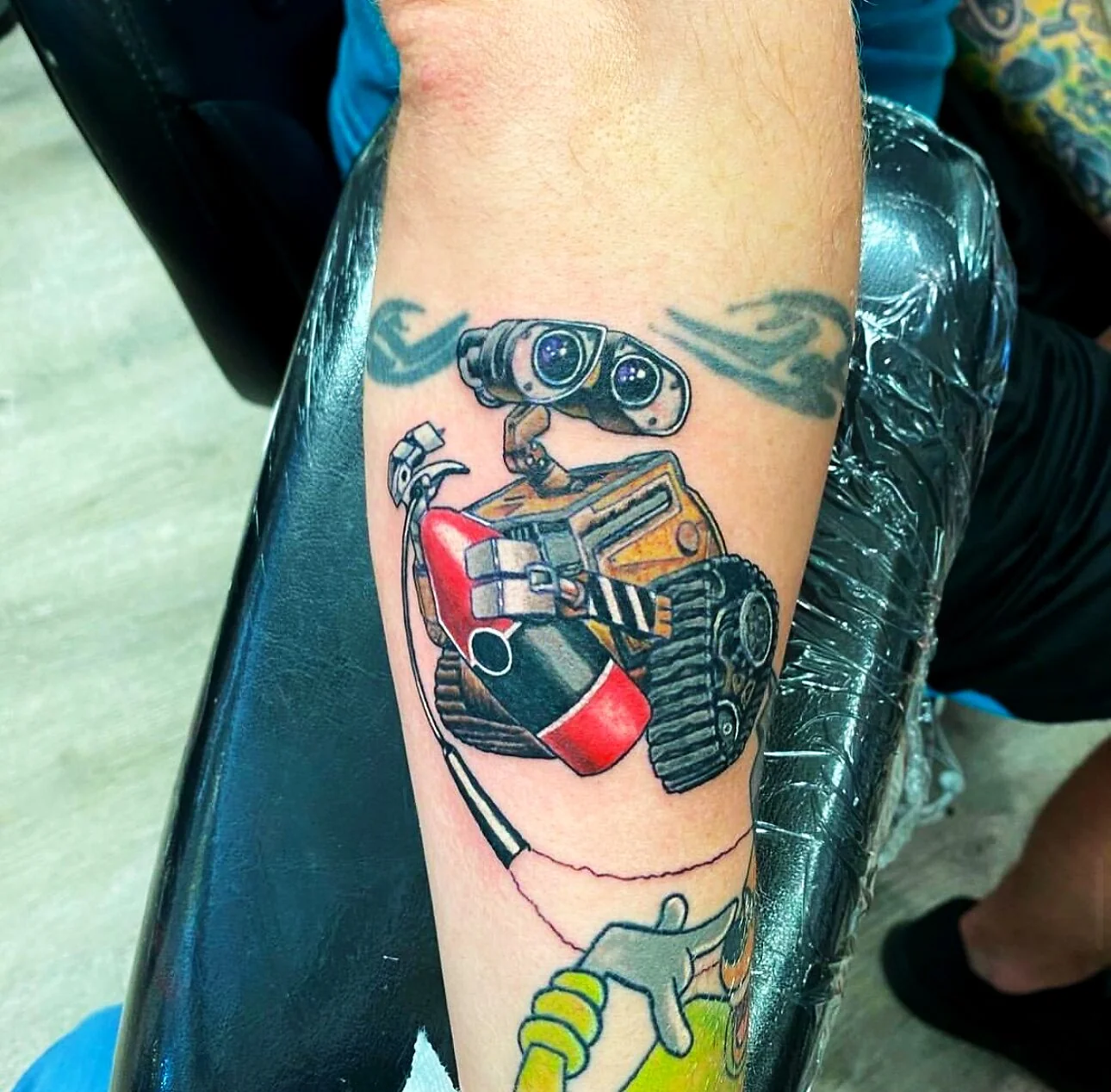Color Realism Wall-E robot character tattoo on calf by 2bit (Chris Curren) at Lost at Sea Tattoo, Chinatown, Honolulu Color Realism Wall-E robot character tattoo on calf by 2bit (Chris Curren) at Lost at Sea Tattoo, Chinatown, Honolulu