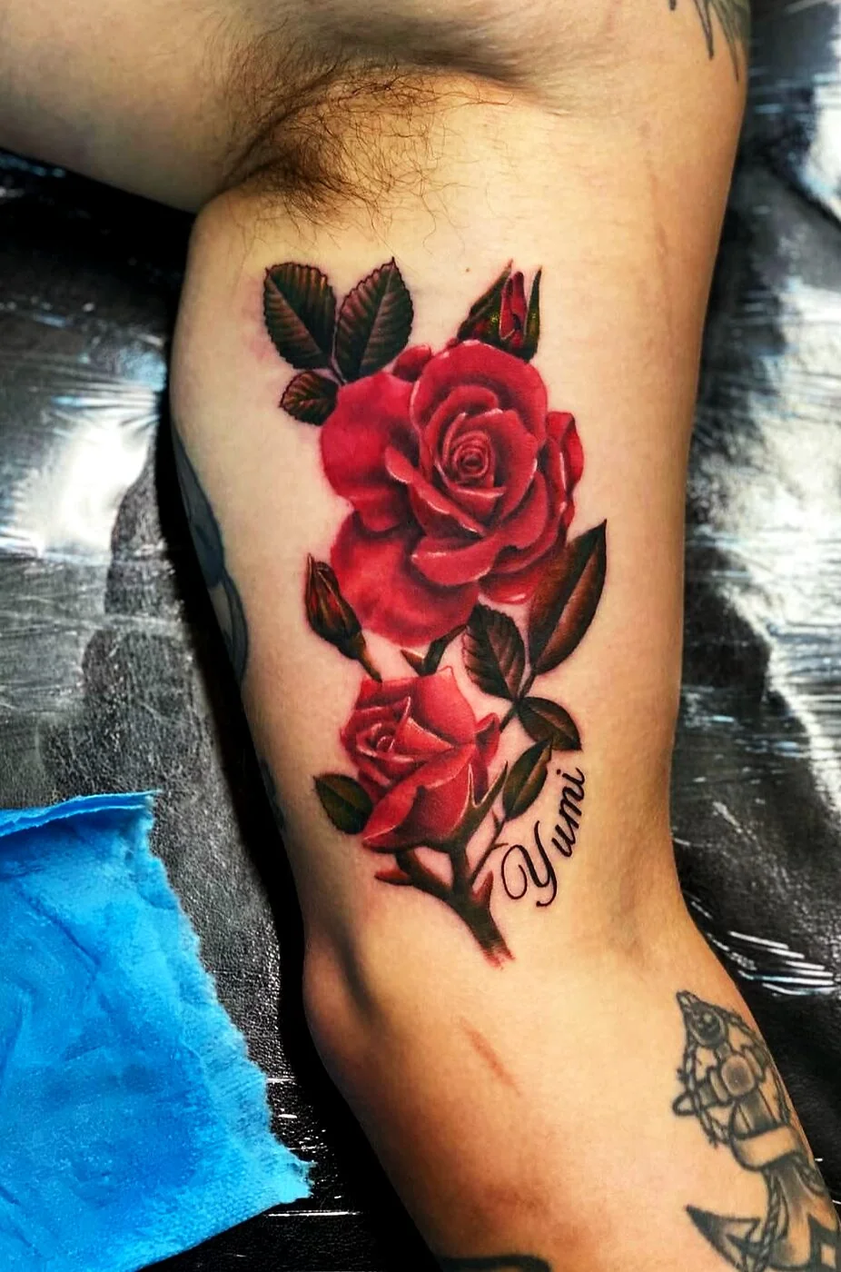 Color Realism red roses with Yumi script tattoo on bicep by 2bit (Chris Curren) at Lost at Sea Tattoo, Chinatown, Honolulu Color Realism red roses with Yumi script tattoo on bicep by 2bit (Chris Curren) at Lost at Sea Tattoo, Chinatown, Honolulu