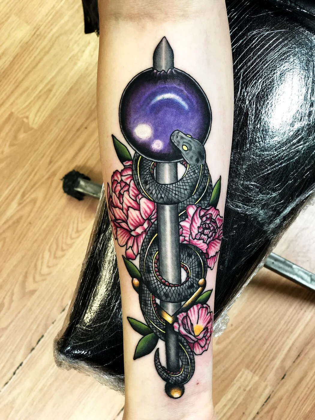 Neo-Traditional snake wrapped around staff with crystal ball and peonies tattoo on forearm by 2bit (Chris Curren) at Lost at Sea Tattoo, Chinatown, Honolulu Neo-Traditional snake wrapped around staff with crystal ball and peonies tattoo on forearm by 2bit (Chris Curren) at Lost at Sea Tattoo, Chinatown, Honolulu